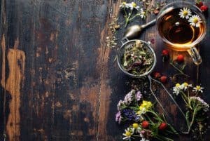 Herbal tea and more over wooden background