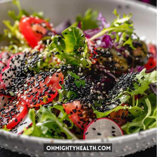 Healthy salad with black seeds on it.